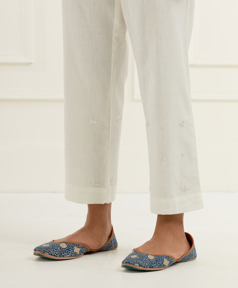 Off-white chanderi cotton flax pants in a slim fit with silver pittan embroidered booti