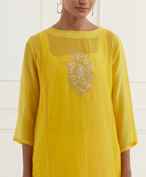 Canary yellow chanderi kurta with pintucks, centre moif pittan embroidery and cotton mulmul slip paired with natural white cotton flax straight fit pants with pittan embroidery