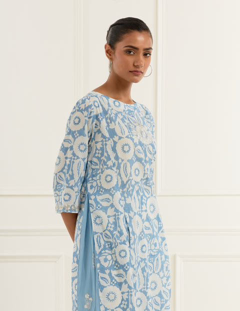 Sky blue floral block print kurta in cotton mulmul with blue embroidered side panels  paired with embroidered offwhite  cotton straight fit pants