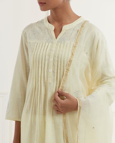 Lemon yellow slub kurta with pleates and pittan flower embroidery yoke details paired with straight pants and chanderi dupatta with pittan flower embroidery
