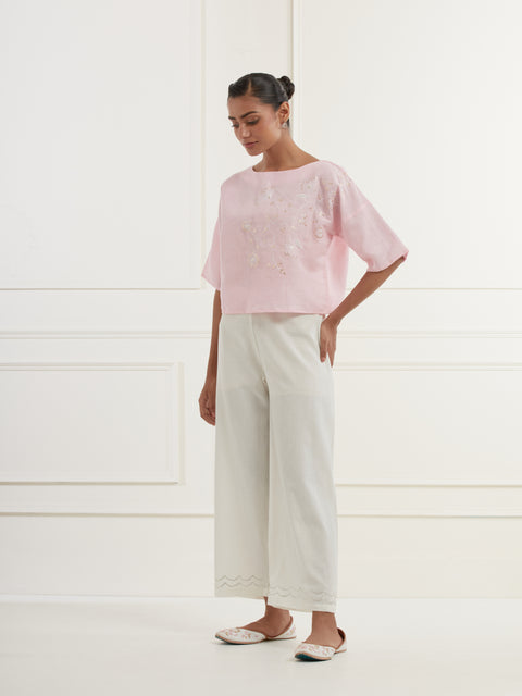 Pink linen top with intricate thread and pittan embroidery paired with offwhite straight fit embroidered cotton pants