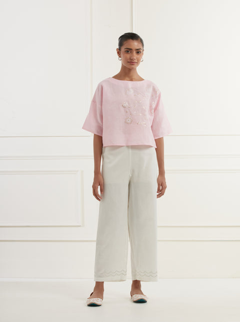 Pink linen top with intricate thread and pittan embroidery paired with offwhite straight fit embroidered cotton pants