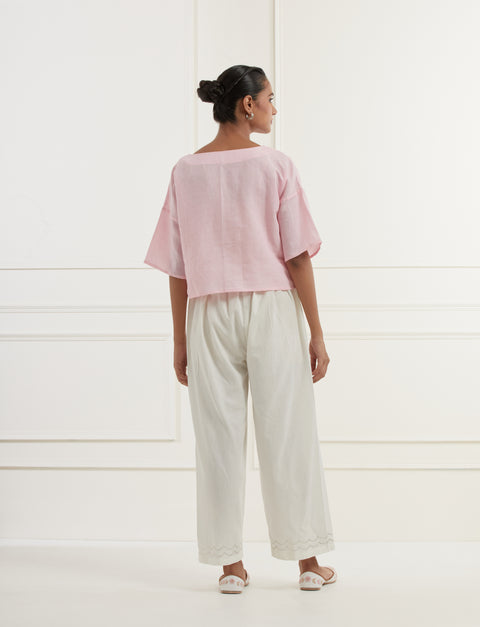 Pink linen top with intricate thread and pittan embroidery paired with offwhite straight fit embroidered cotton pants