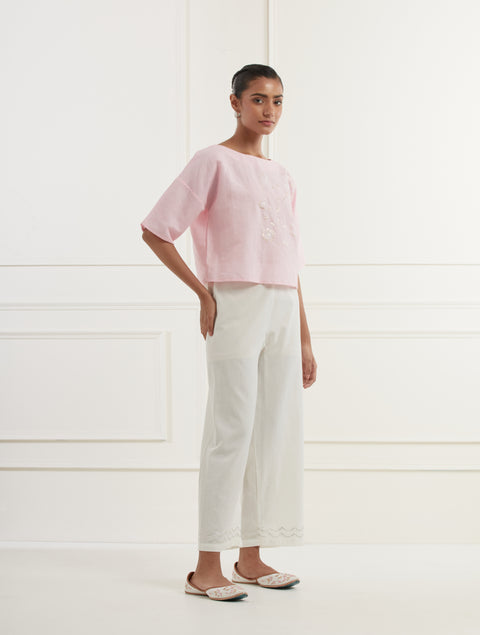 Pink linen top with intricate thread and pittan embroidery paired with offwhite straight fit embroidered cotton pants